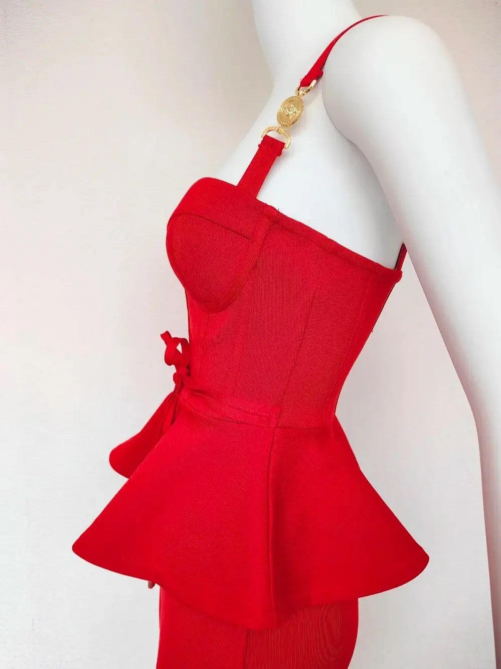 Red peplum top on a mannequin against a white background