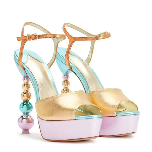 Pair of color block platform sandals with a beaded stiletto heel.