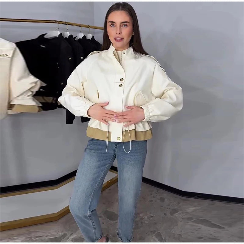 Model wearing a beige drawstring waist jacket