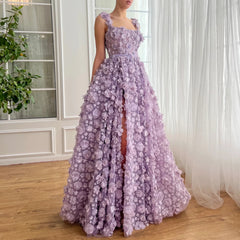 A model wearing the lilac 3D floral gown, showcasing its elegant silhouette and the daring high slit. Golden Atelier 3