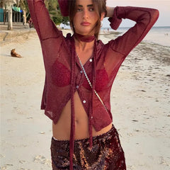 Woman in a red outfit on a beach
