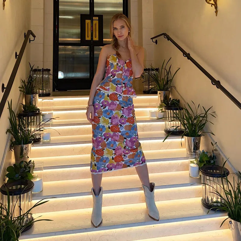 Floral print strapless peplum top and midi skirt set on stairs
