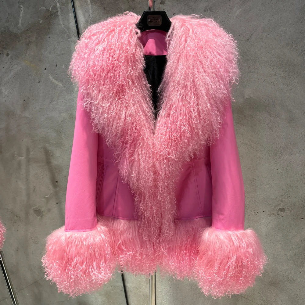 Pink fur coat on a hanger against a gray background