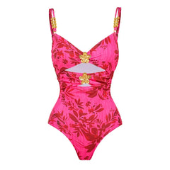 Close-up of pink floral print one piece swimsuit with gold embellishments