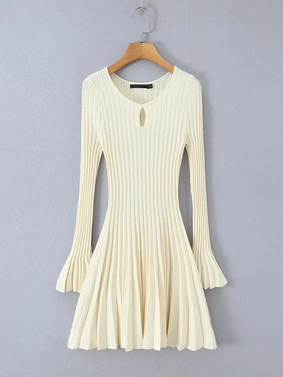 White ribbed dress on a wooden hanger - full flare sleeves