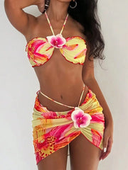 Embellished swimwear set with floral appliqu�s and mesh skirt.