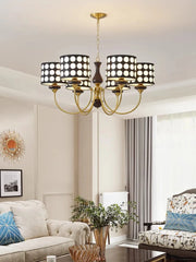 A retro-inspired polka dot chandelier with a minimalist design, hanging in a modern living room.