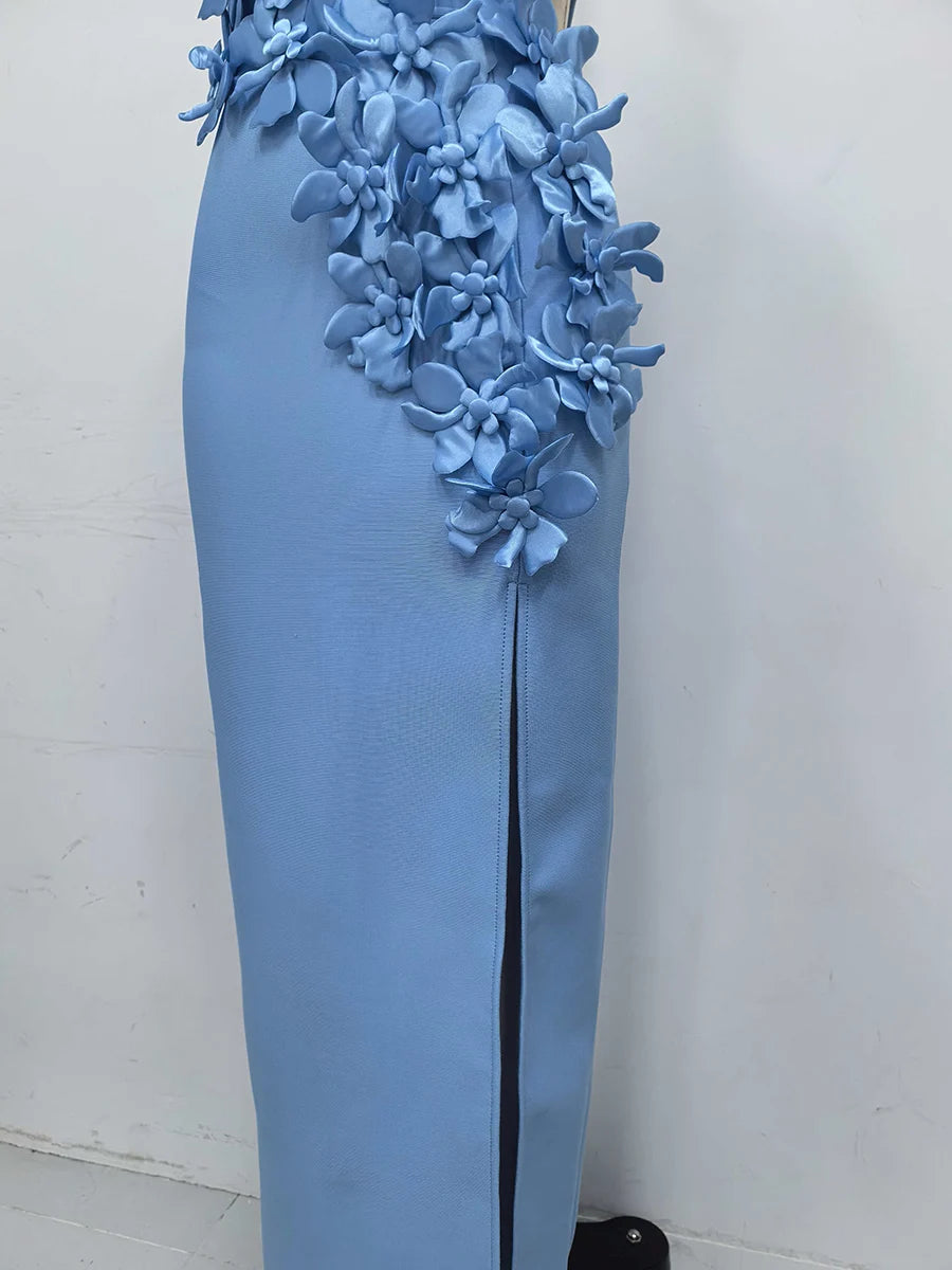 Light blue evening gown with floral embellishments on a white background