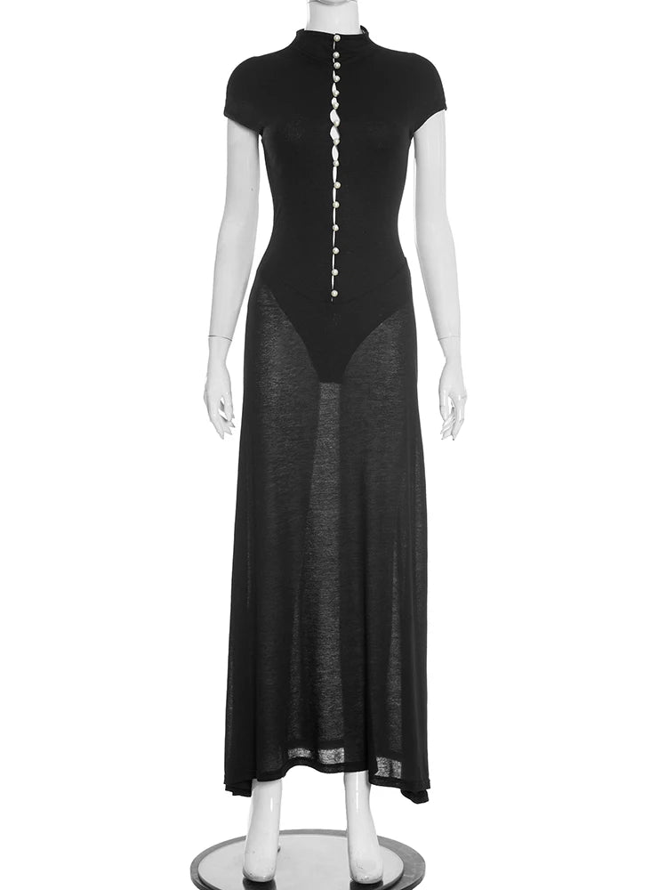 Black dress with a sheer overlay on a mannequin against a white background