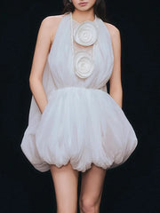 Light blue dress with floral embellishments on a black background