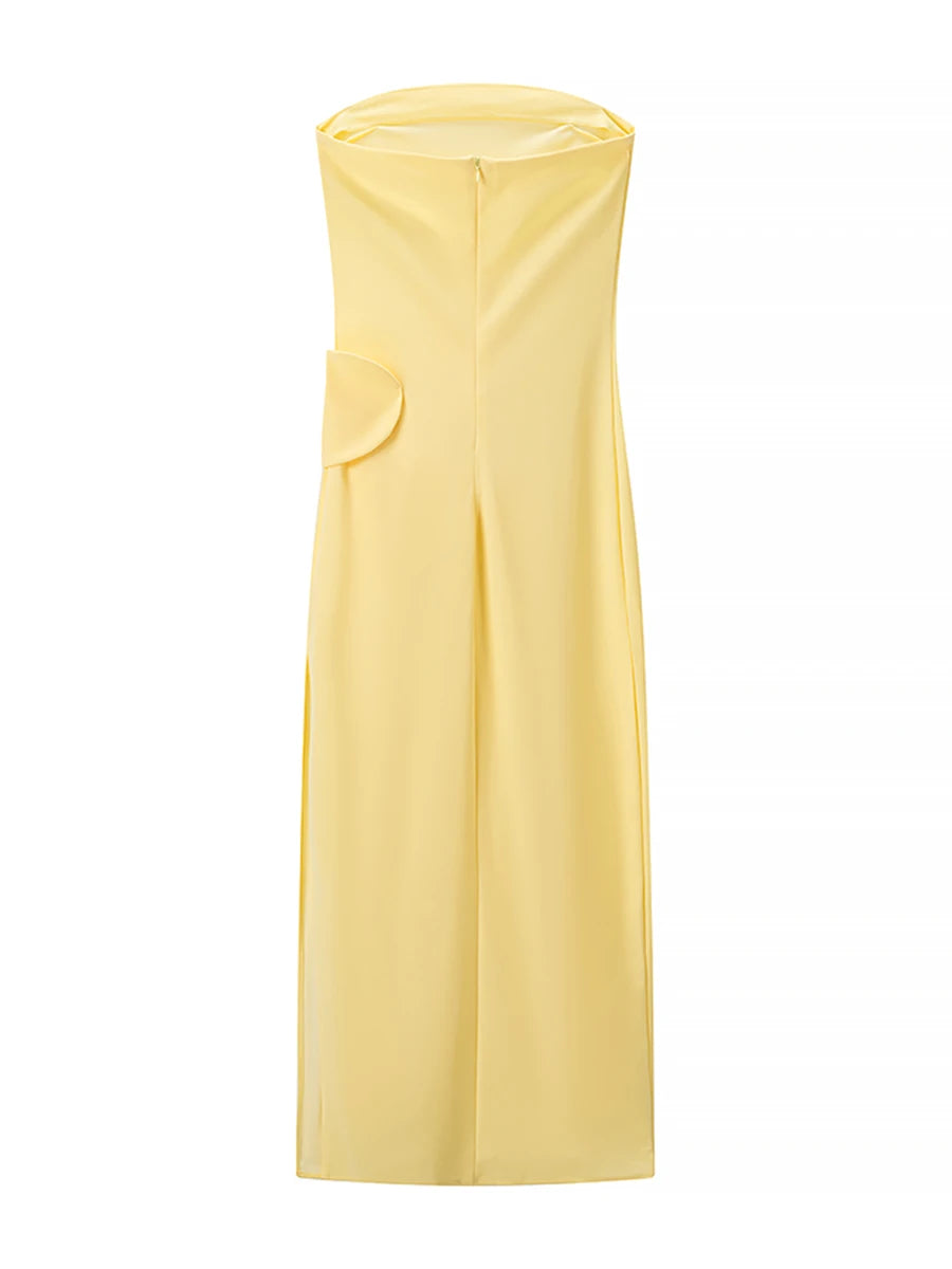 Yellow dress with a slit on a white background