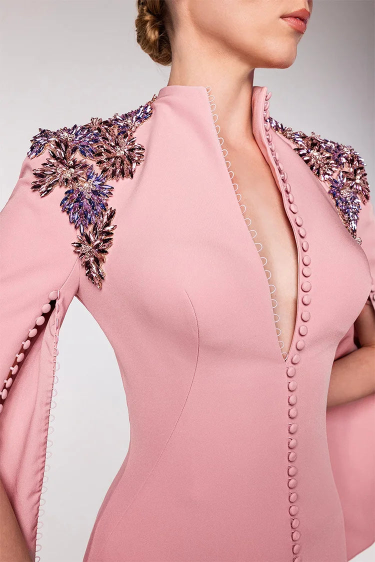 Close-up of jeweled shoulder embellishments and v-neckline on pink maxi dress