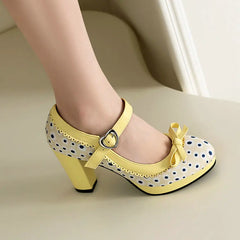 Yellow polka dot Mary Jane platform heels with ankle strap and bow
