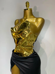 Close-up of gold metallic corset top on mannequin