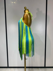 Back view of lime green and blue alternating fringe halter mini dress