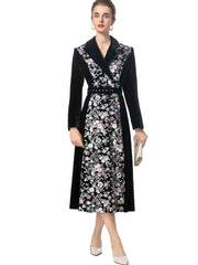 Full view of a model wearing a velvet floral embroidered midi dress