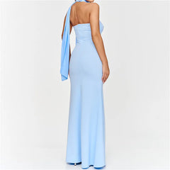 Light blue halter neck gown on a plain background