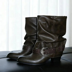Dark brown slouch ankle boots with stitching details and a decorative buckle strap.