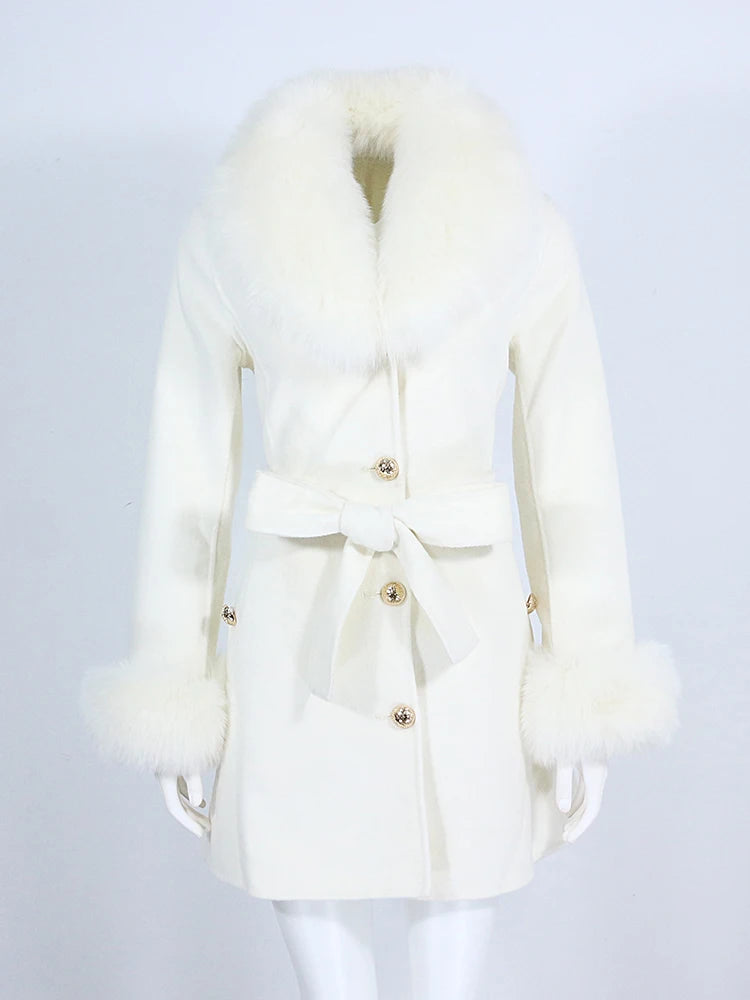 White coat with fur collar on a mannequin against a light gray background