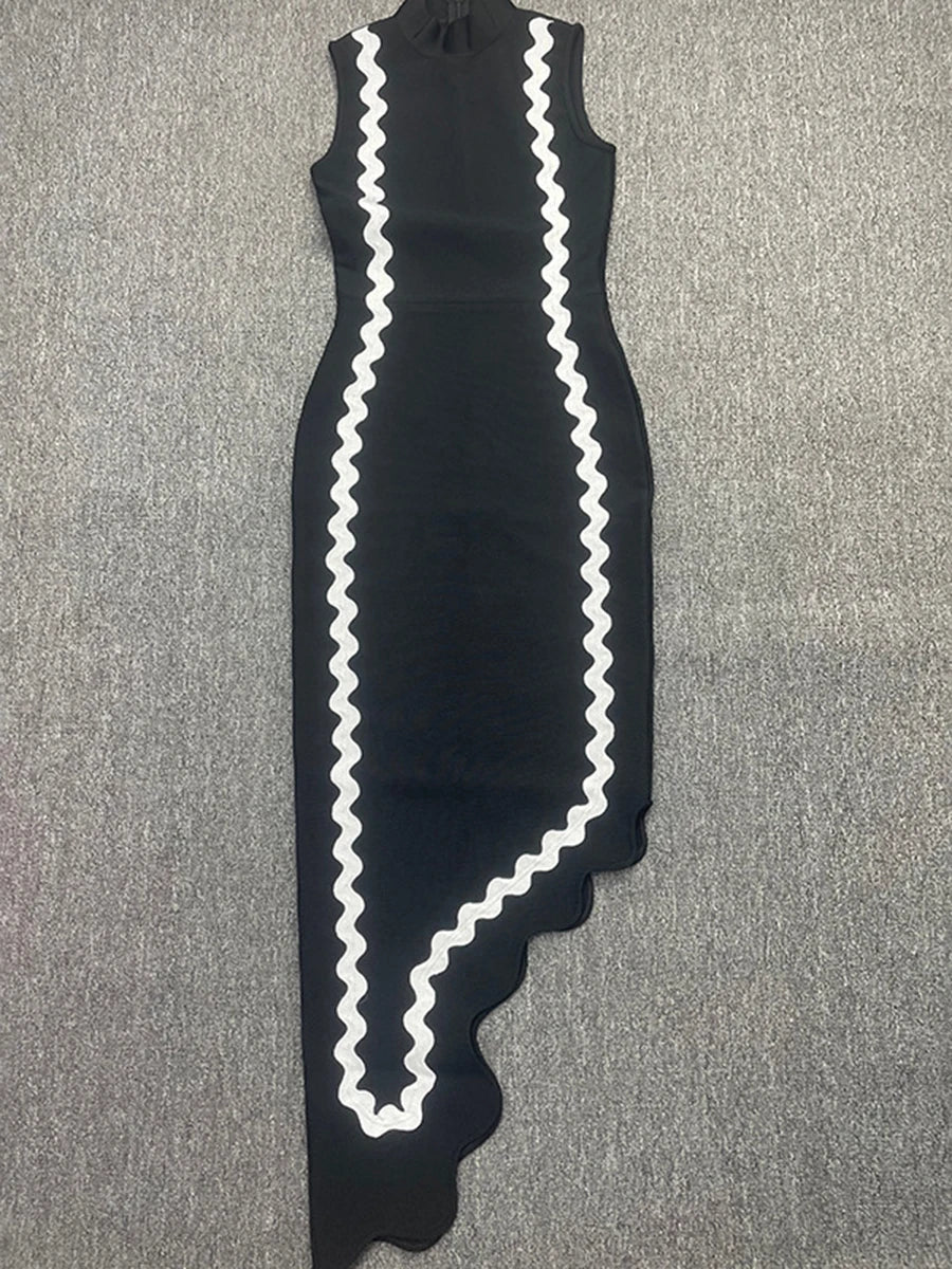 Black dress with white zigzag pattern on a gray surface