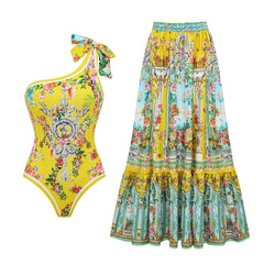 Flat lay of a one-piece swimsuit and a matching maxi skirt with vibrant print