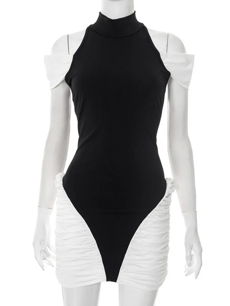 Black bodysuit with white ruffled sleeves on a mannequin against a white background