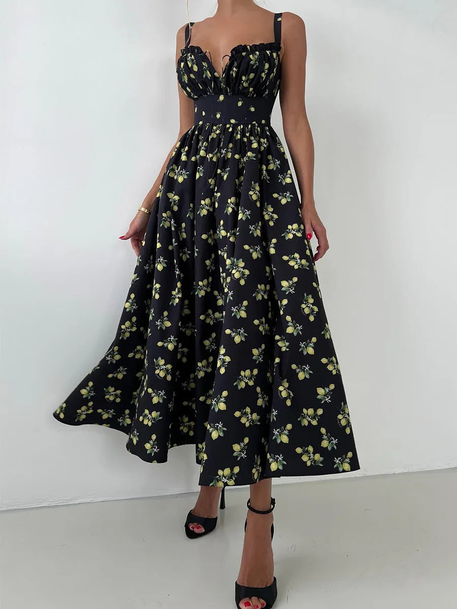 Black floral dress worn by a person on a white background