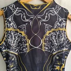 Close-up of black graphic print sleeveless mesh top detail