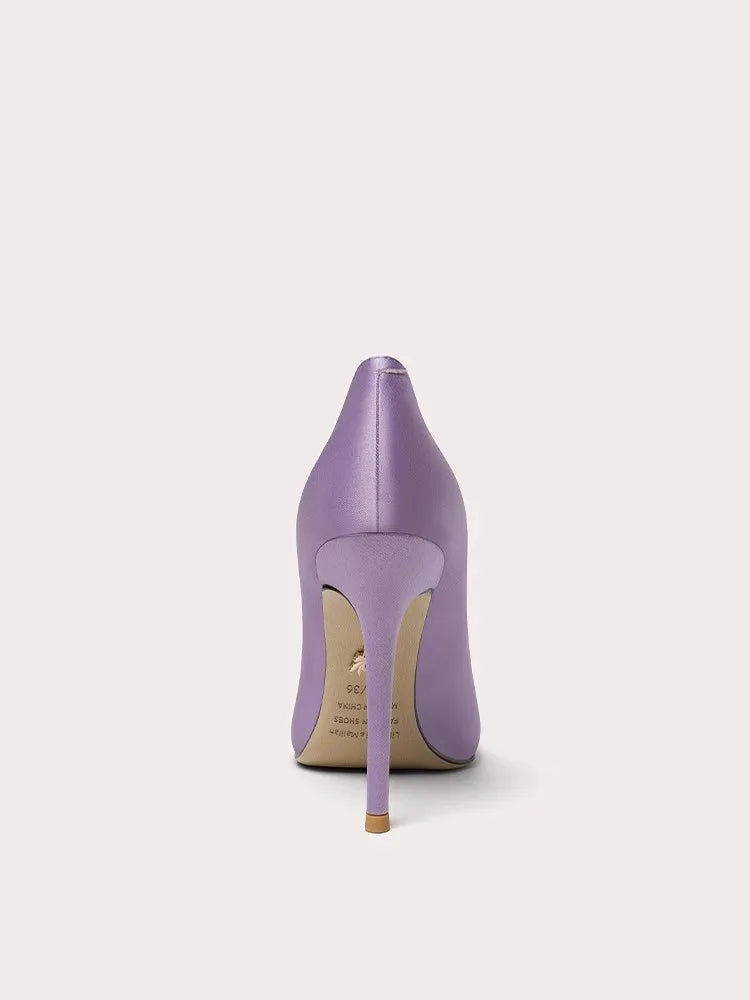 Purple high-heeled shoe on a light gray background