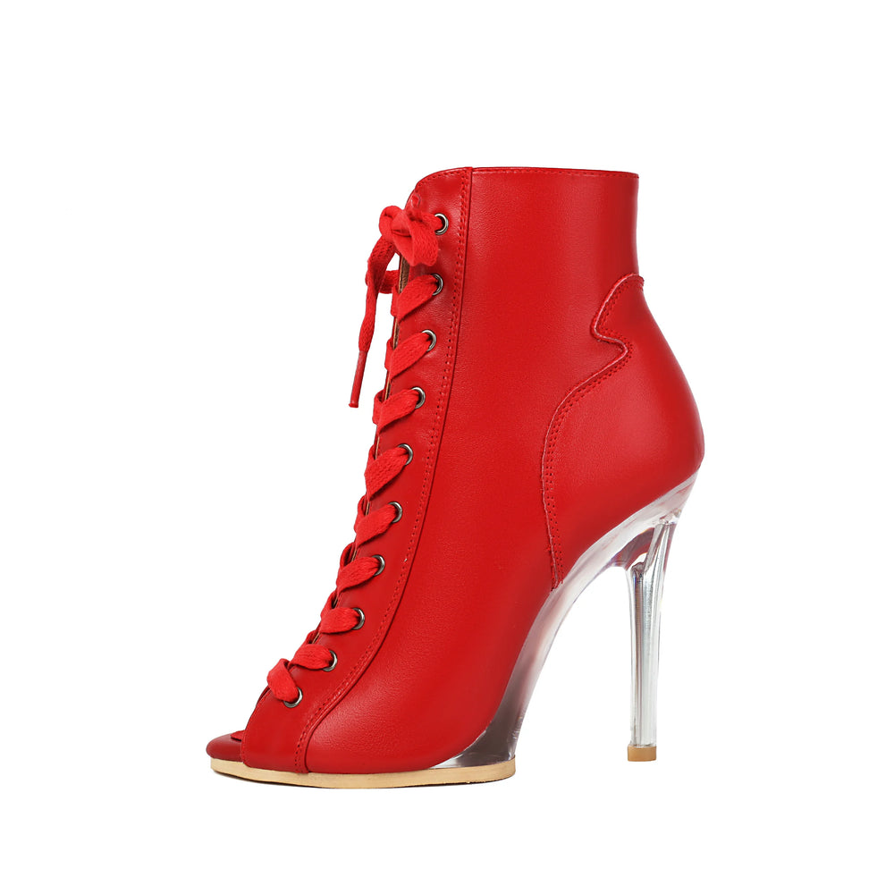 Red high-heeled shoe with clear heel on a white background