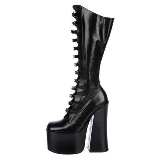 Black platform boot with high heel on a white background