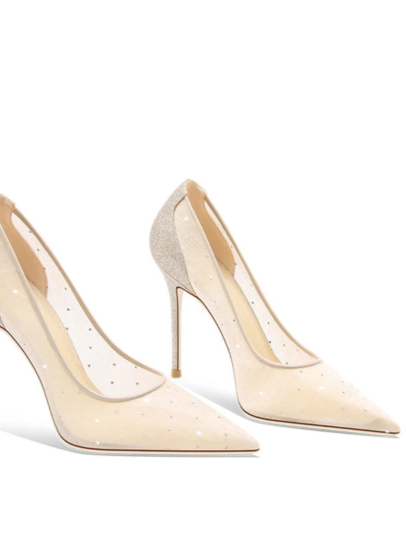 Pair of beige high-heeled shoes on a white background