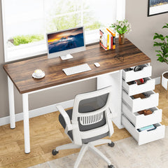 Home office setup with a wooden desk, computer, chair, and storage drawers.