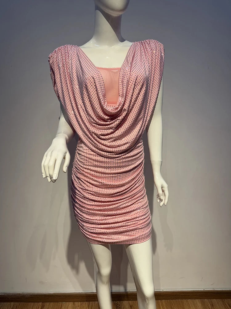 Mannequin wearing a pink beaded dress against a plain background