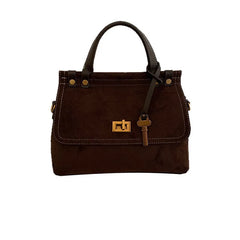 Brown handbag with gold lock on a white background
