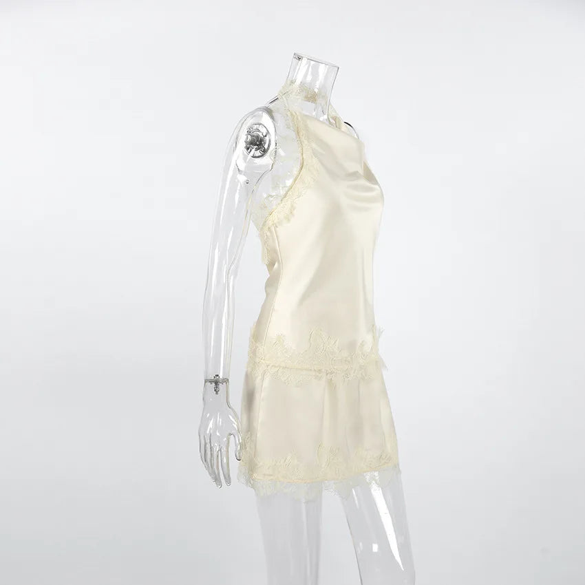 Mannequin wearing a light-colored dress on a white background