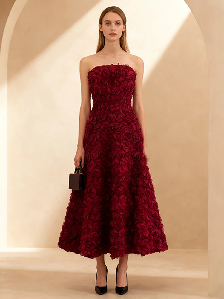 Close-up of rose appliqué on burgundy A-line dress