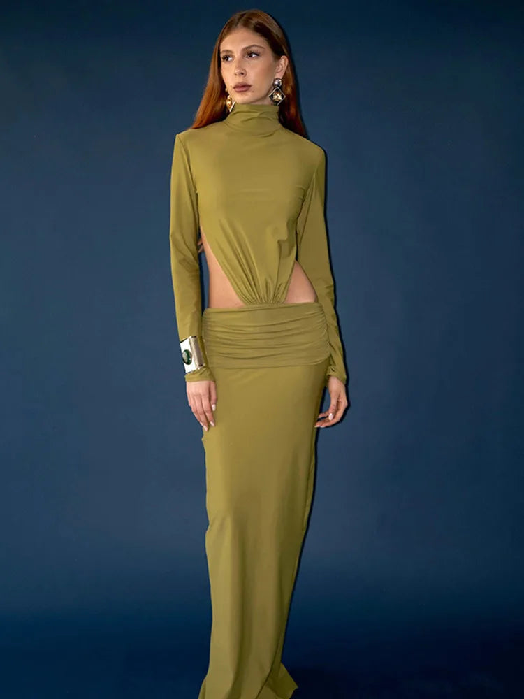 Woman wearing a green outfit against a blue background