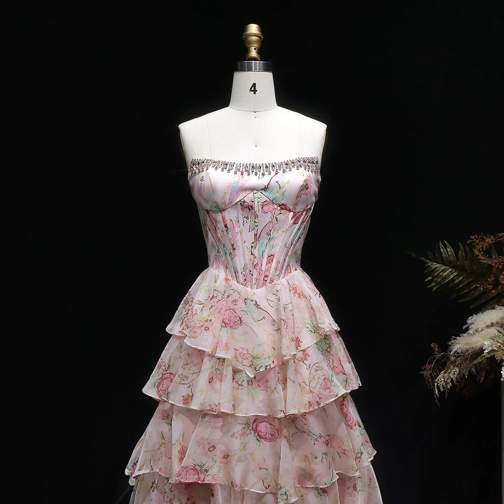 Floral dress on a mannequin against a black background