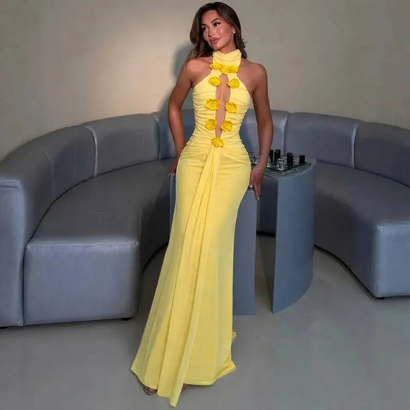 Full length view of a yellow halter neck floral gown