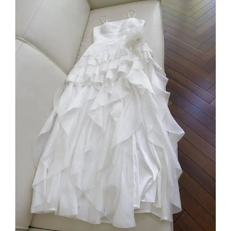 Strapless ruffle trim dress draped on a sofa