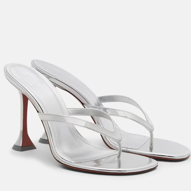 Side view of metallic flip flop heels showcasing the sleek design.