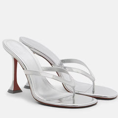 Side view of metallic flip flop heels showcasing the sleek design.