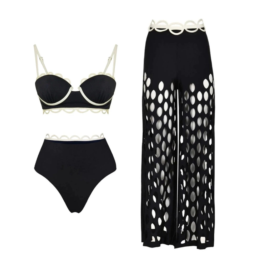 Black underwire bikini with white trim and high-waisted bikini bottoms, paired with wide-leg cutout pants