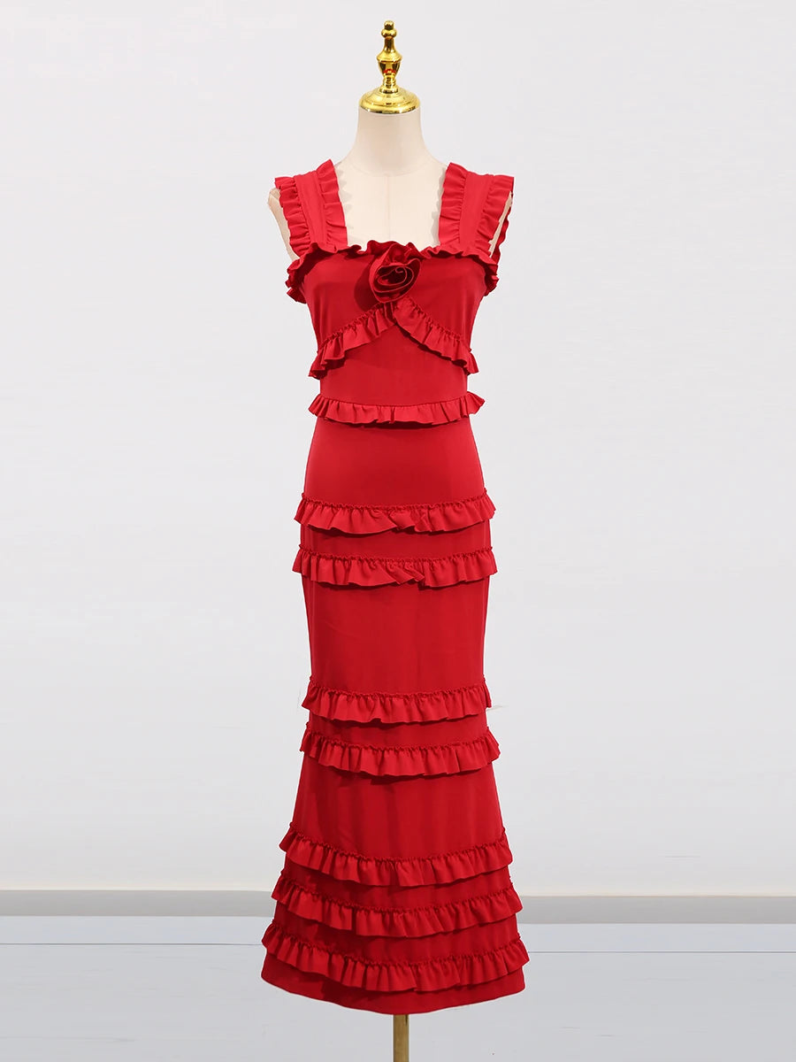 Red ruffled dress on a mannequin against a white background