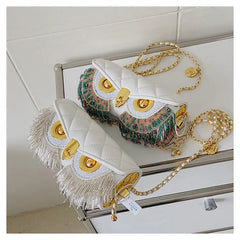 Two white quilted owl chain bags with beaded detail and fringe