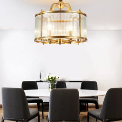  Modern gold chandelier with cascading glass pendants, illuminating a stylish living room. Golden Atelier 2