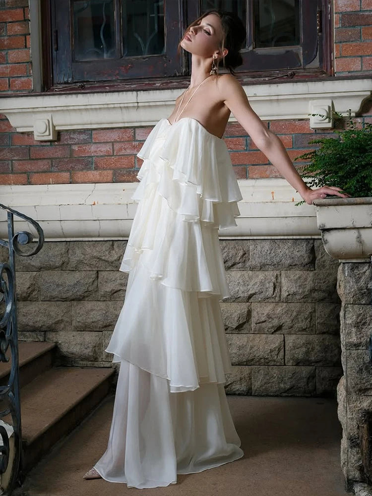 Strapless ruffled chiffon maxi dress on stairs