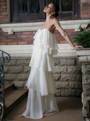 Strapless ruffled chiffon maxi dress on stairs