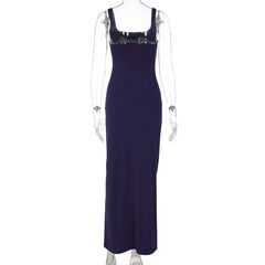 Navy blue evening gown on a mannequin against a white background